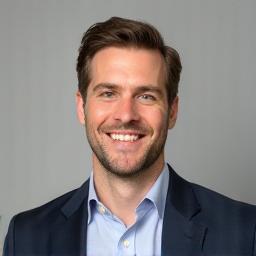 Professional portrait of Ben Carter, a man with short brown hair and a friendly smile.