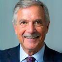 Portrait of Michael Brown, a man with short grey hair and a kind smile.